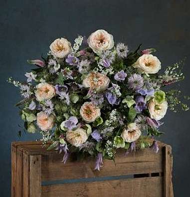 a bouquet of white and purple roses