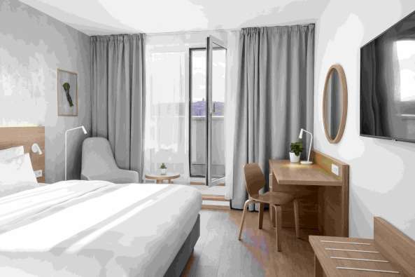 rendering of the insider of a bright white hotel room