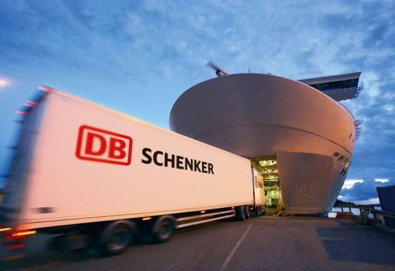 photo of a db schenker truck driving into a large boat