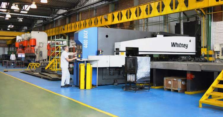 Fanalca employee working distribution center machinery