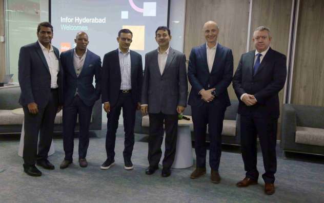 6 men in suits at Infor Development Center Hyderabad India