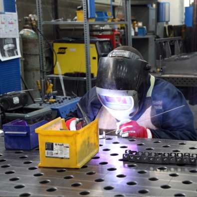 photo of a welder working in the lesto product factory