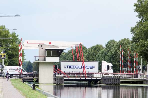 photo of a nedschroef truck crossing a bridge