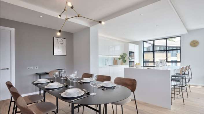 photo of the dining room and kitchen in a modern apartment