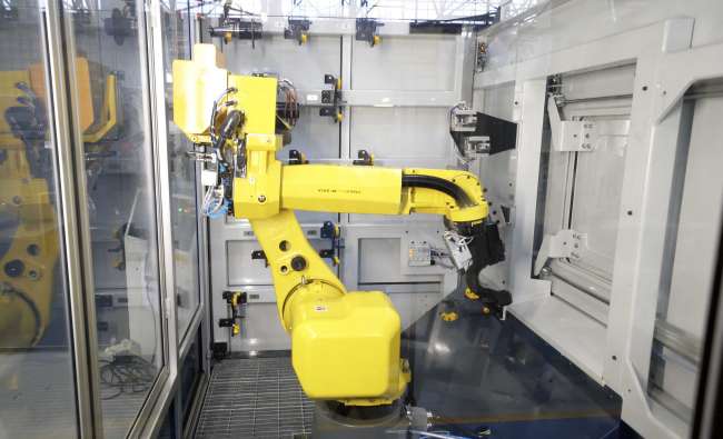 yellow robotic arm for manufacturing