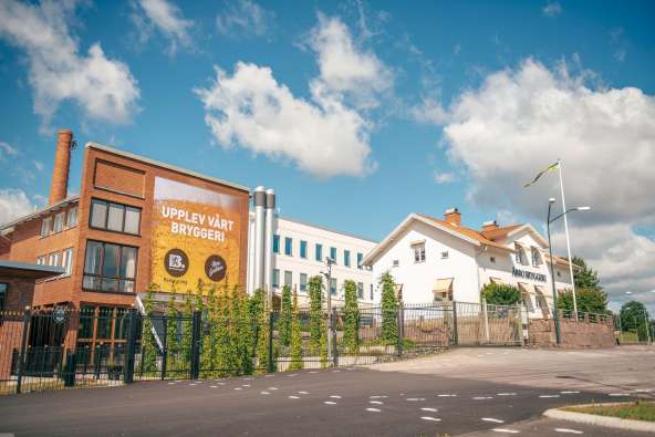 photo of the exterior of the abro brewery under blue skies