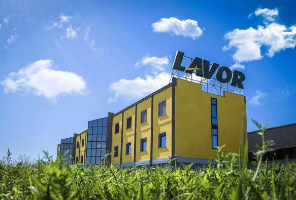 photo of the exterior of a blue and yellow lavor building