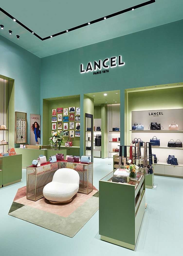 photo of the inside of a green lancel paris store