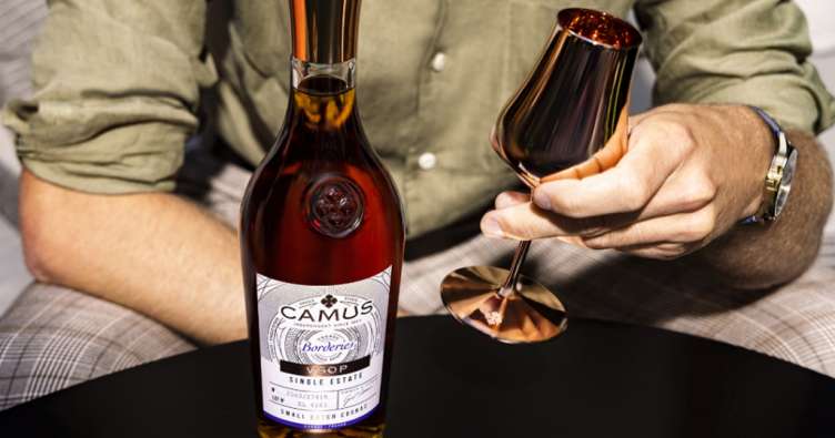 La Maison Camus bottle goblet man hands
