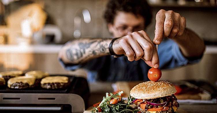 photo of a chef making a hamburger