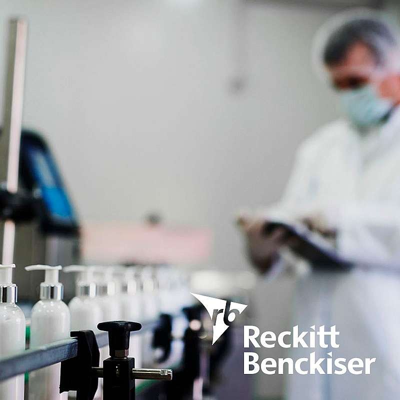 Reckitt Benckiser logo with factory in the background